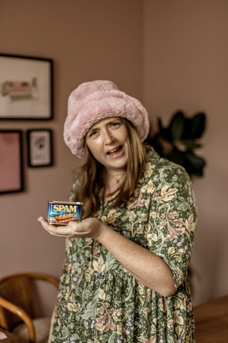 Aime Cox-Tennant proudly holding a tin of Spam at the Studio Cotton design studio