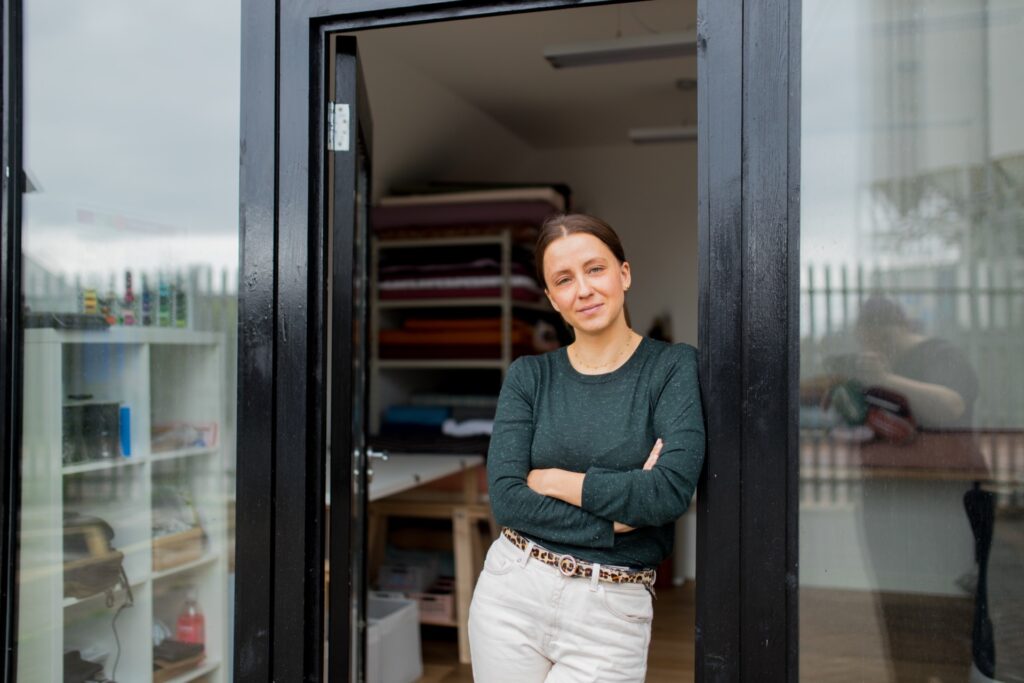 Good Fabric founder, Polina, posing outside her studio in Wimbledon