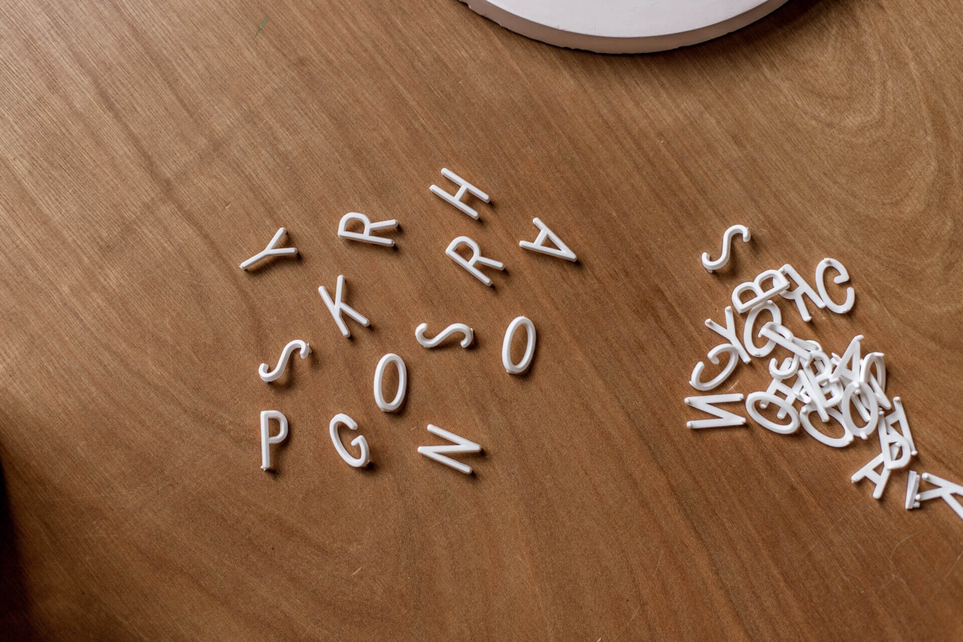 Some letters on a table that would make for a terrible brand identity