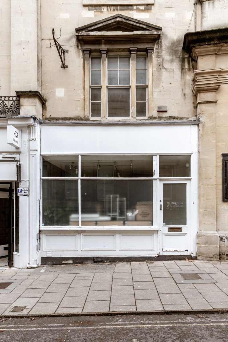 An 'before' shot of the exterior of our Old City studio at 63 Broad Street, Bristol BS1 2EJ. Studio Cotton is photographed straight on. It has white walls and large windows at the front of the building.
